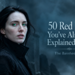 Featured image for “50 Red Flags You’ve Already Explained Away — The Banshee Files,” showing a pale dark-haired woman with vivid green eyes in a black high-collared coat, standing against a weathered stone wall in a cold, misty blue-gray landscape, with the title text displayed beside her.